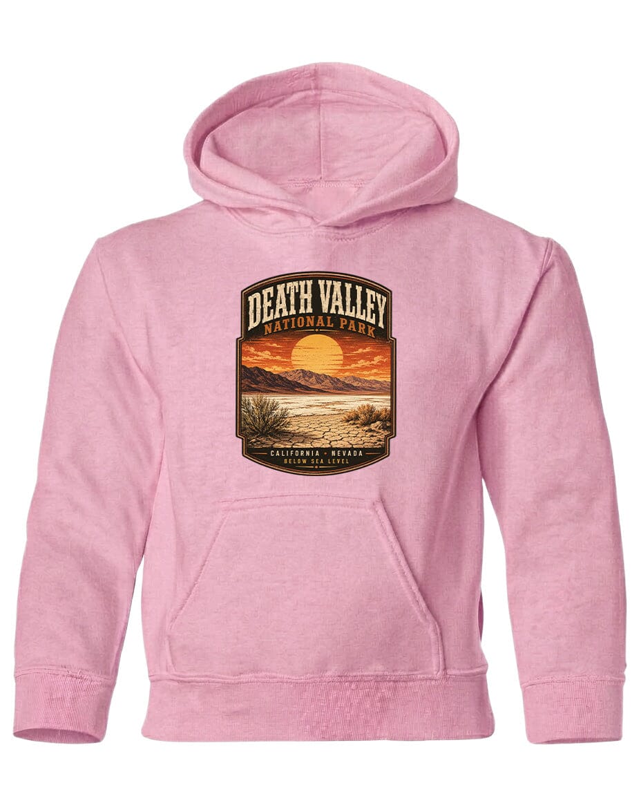 A pink hoodie with a graphic design depicting Death Valley National Park and a sunset landscape.