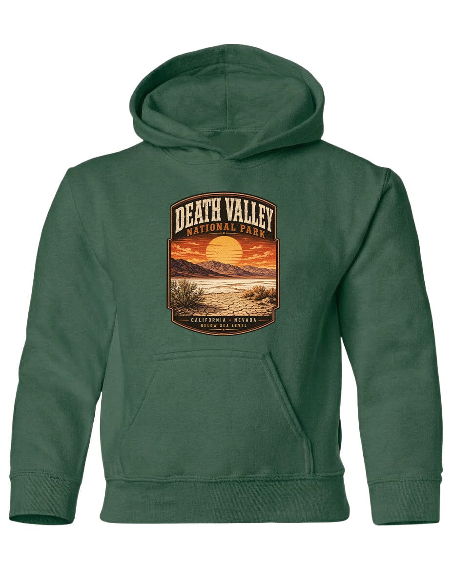 A green hoodie with a graphic design depicting Death Valley National Park, including a sunset, mountains, and desert landscape.