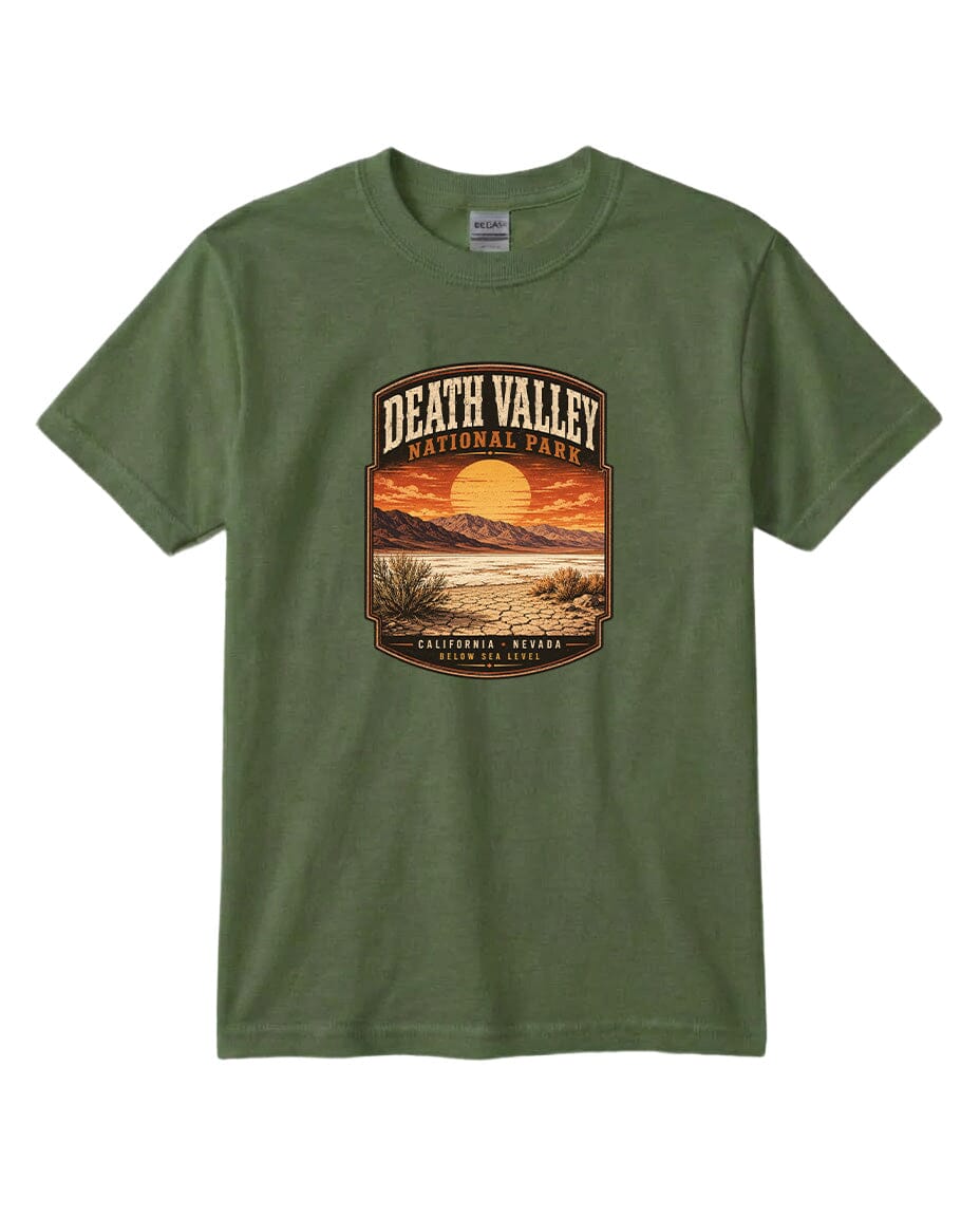 A green t-shirt with a graphic design depicting a sunset over Death Valley National Park, California, USA.