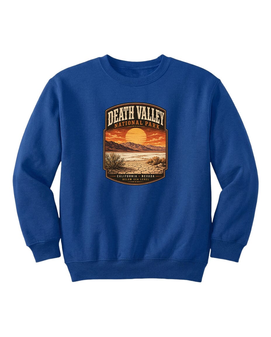 A blue sweatshirt with a graphic design depicting a sunset over Death Valley National Park.
