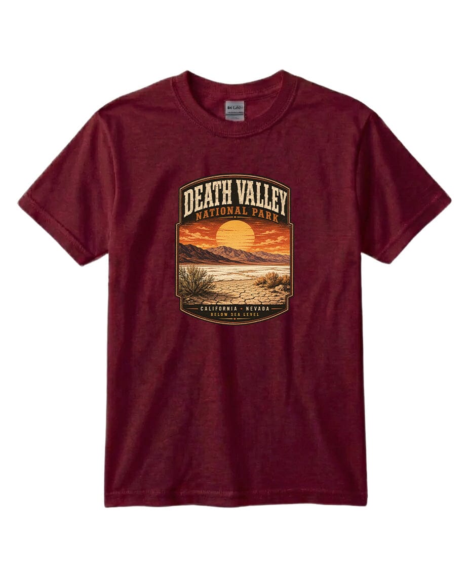 A burgundy-colored t-shirt with a graphic design depicting a sunset over Death Valley National Park, California, Nevada.