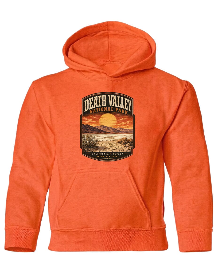 An orange hoodie with a graphic design depicting Death Valley National Park and a sunset landscape.