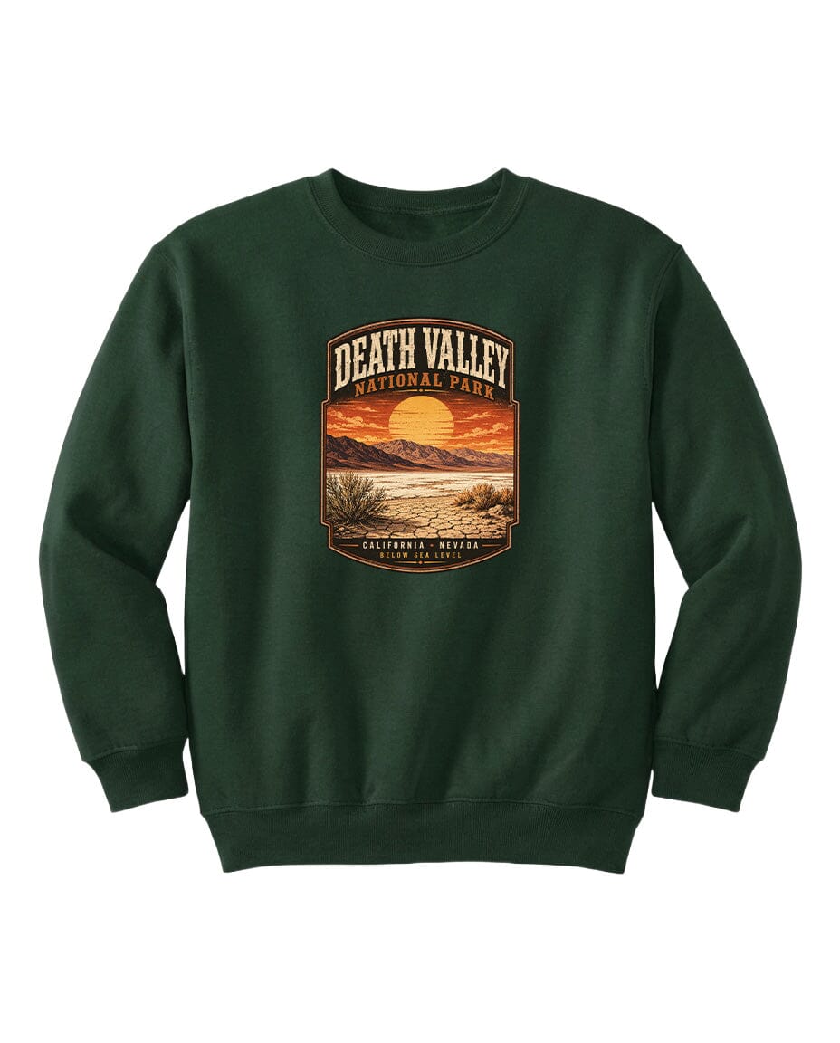 A green sweatshirt with a graphic design depicting a sunset over Death Valley National Park.