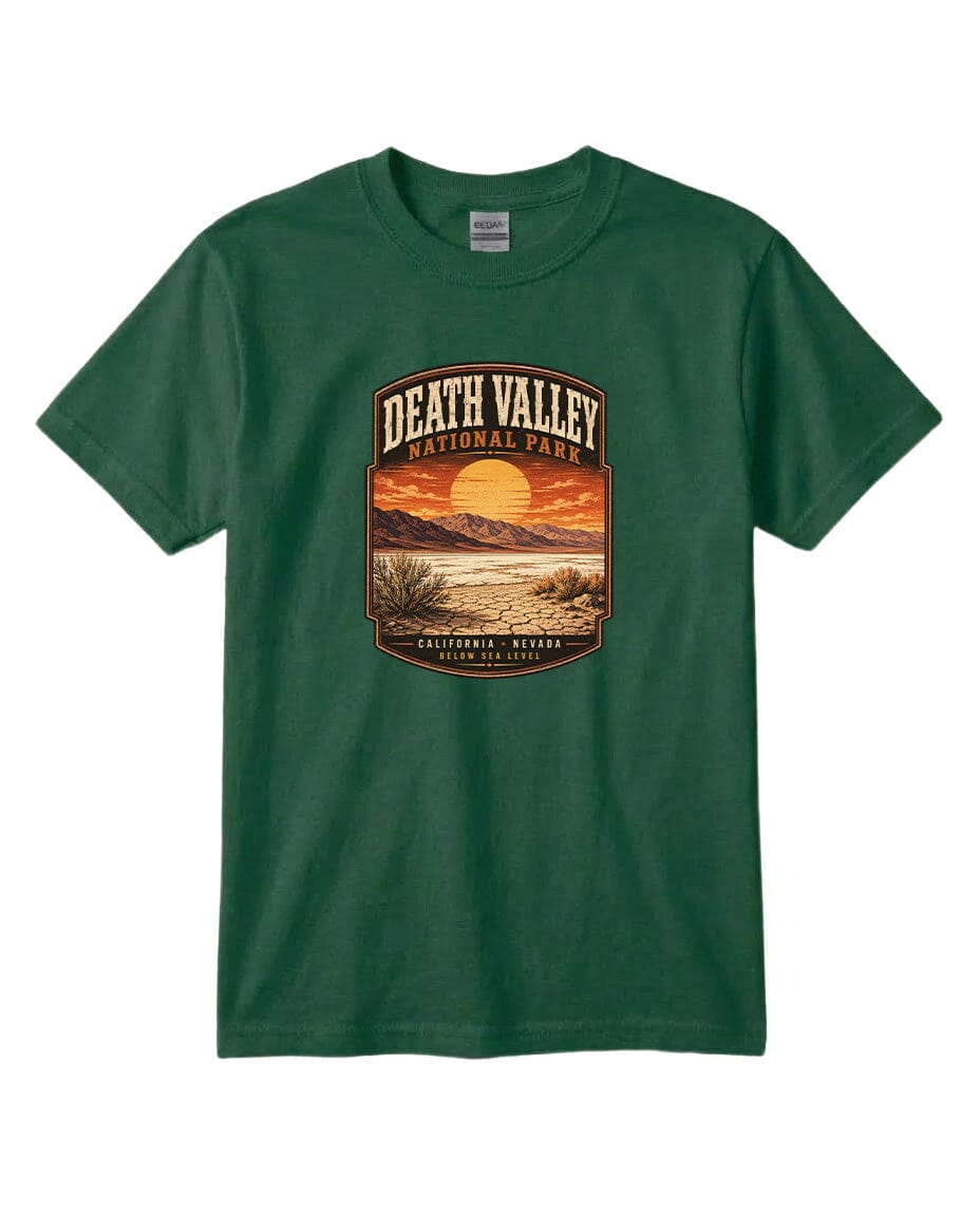 A green t-shirt with a graphic design depicting a sunset over Death Valley National Park, California, USA.