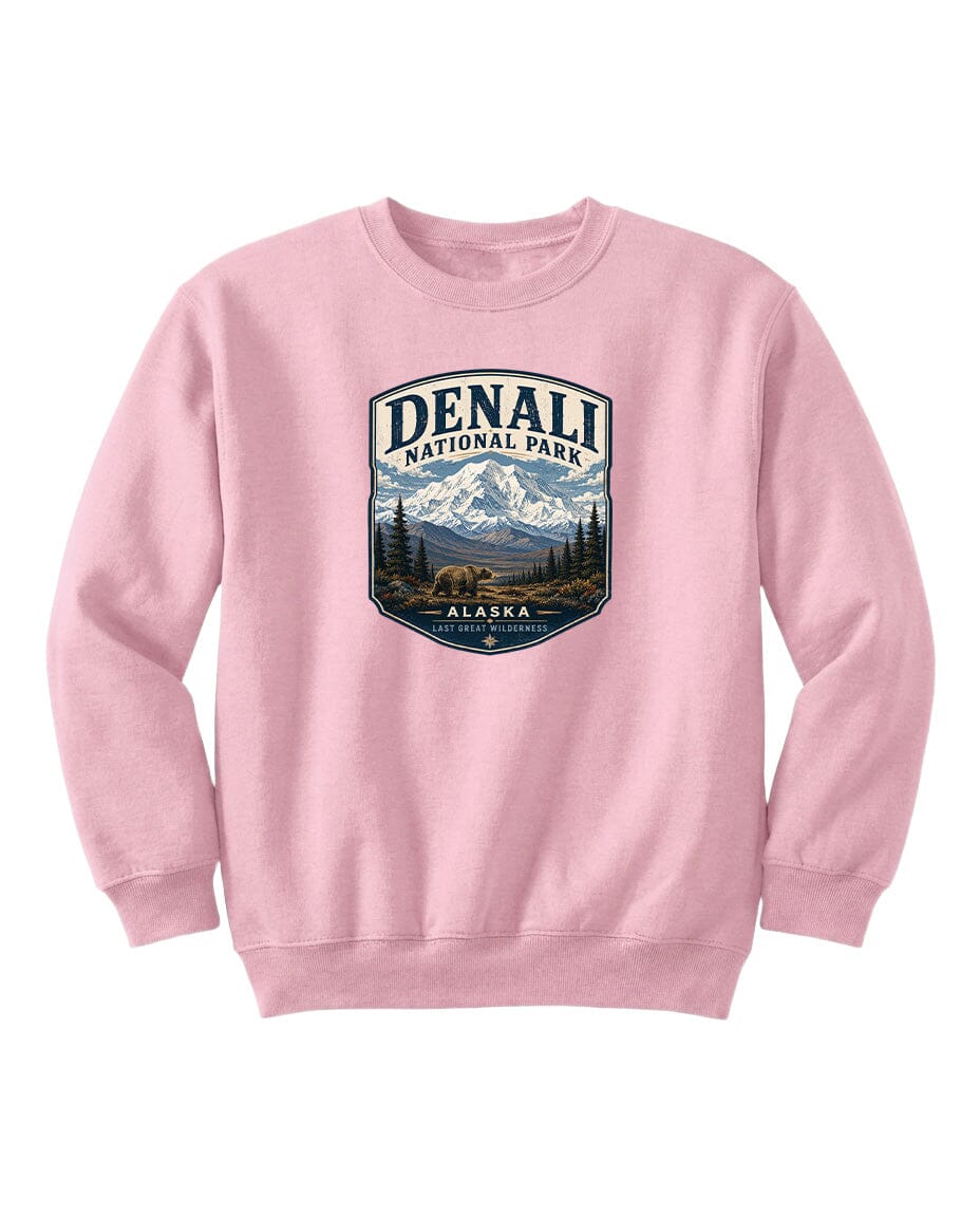 A pink sweatshirt with a graphic design featuring a mountain landscape and bears, representing Denali National Park in Alaska.