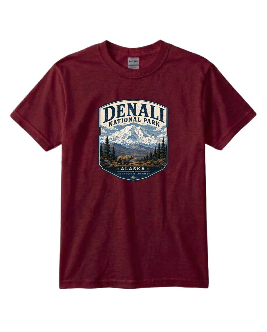 A burgundy-colored t-shirt with a graphic design depicting a mountain landscape and bears, along with the text "DENALI NATIONAL PARK ALASKA LAST GREAT WILDERNESS".