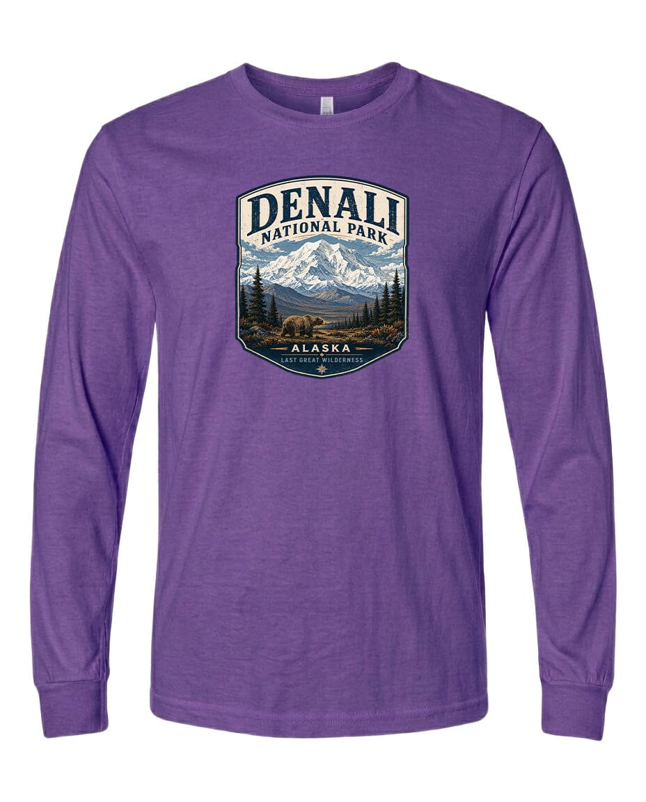 A purple long-sleeved t-shirt with a graphic design depicting Denali National Park in Alaska.