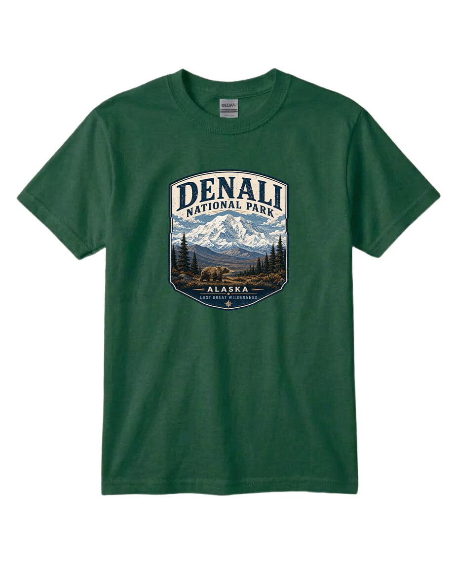 A green t-shirt with a graphic design featuring a mountain landscape and the text "DENALI NATIONAL PARK ALASKA LAST GREAT WILDERNESS".