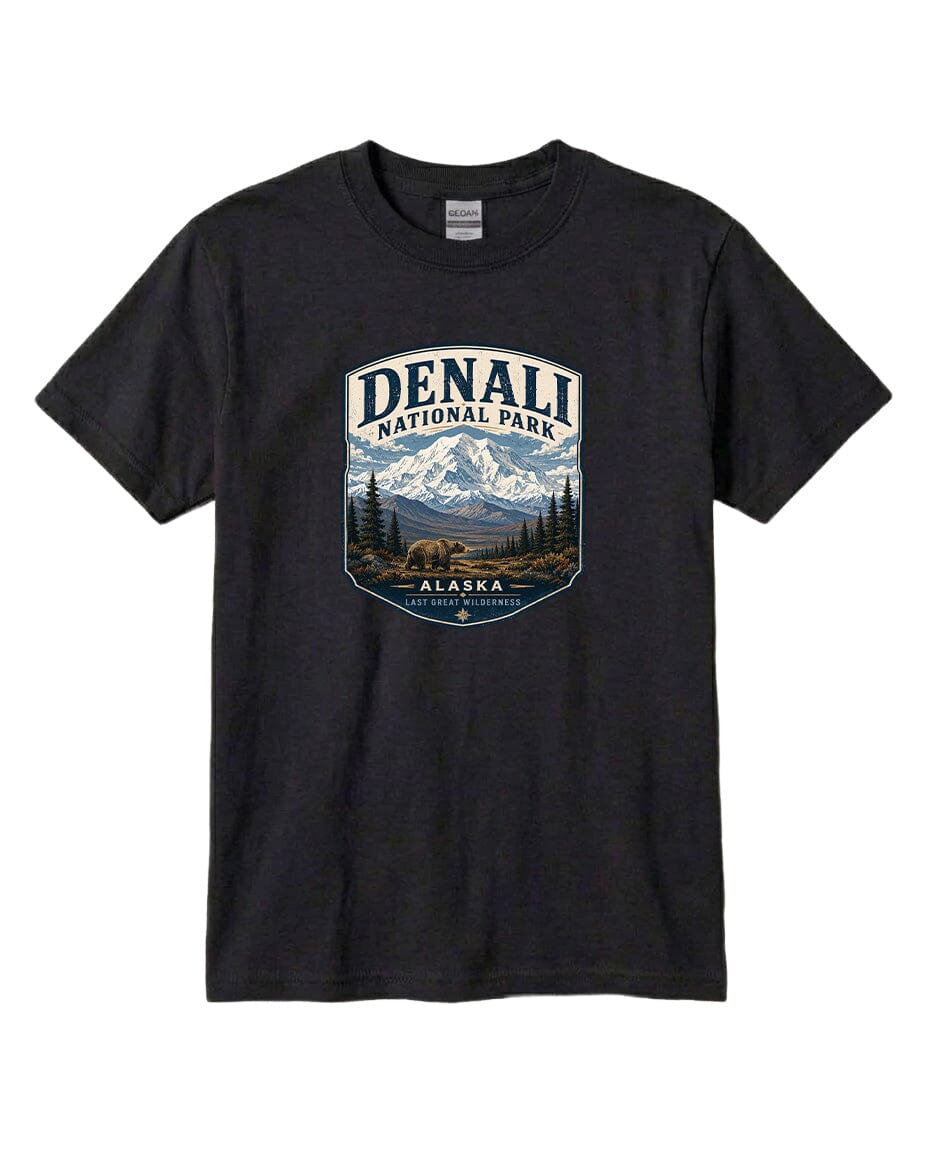 A black t-shirt with a graphic design depicting a mountain landscape with a bear, surrounded by text that says "DENALI NATIONAL PARK ALASKA LAST GREAT WILDERNESS".
