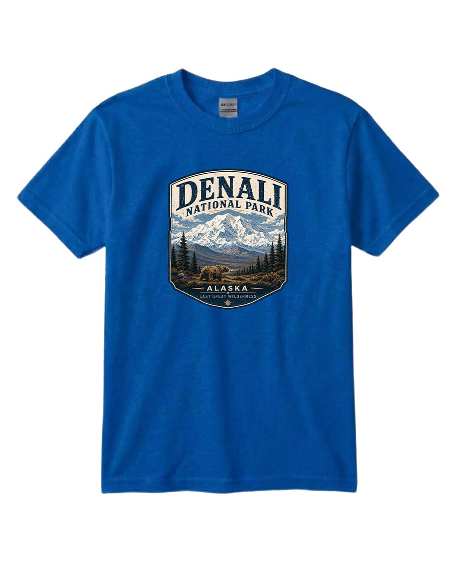 A blue t-shirt with a graphic design depicting a mountain landscape with a bear, surrounded by text that says "DENALI NATIONAL PARK ALASKA LAST GREAT WILDERNESS".