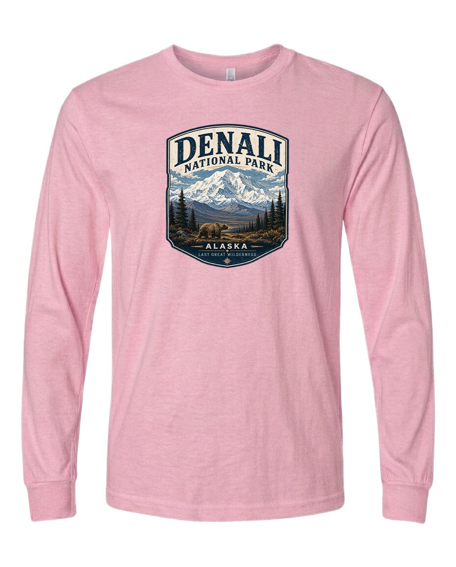 A pink long-sleeved t-shirt with a graphic design depicting Denali National Park in Alaska.