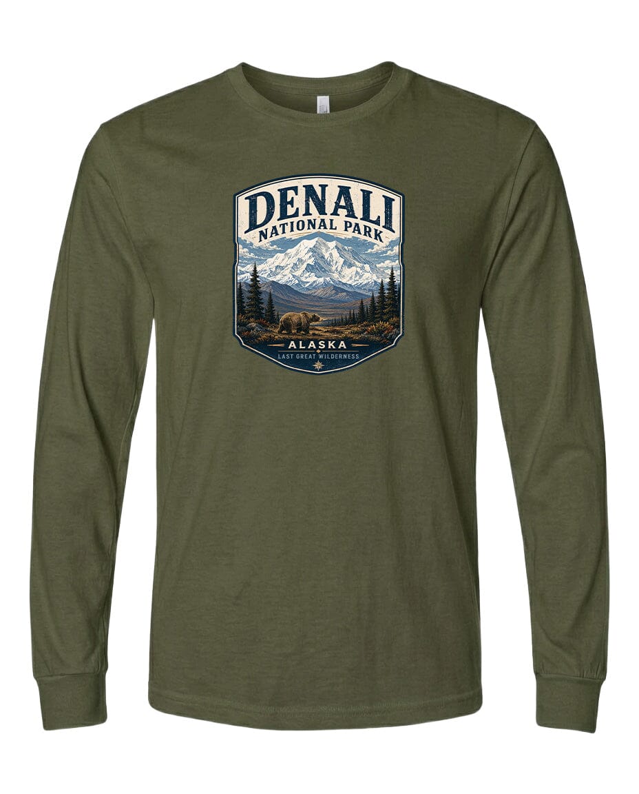 A long-sleeved olive green t-shirt with a graphic design featuring a mountain landscape and the text "DENALI NATIONAL PARK ALASKA LAST GREAT WILDERNESS".