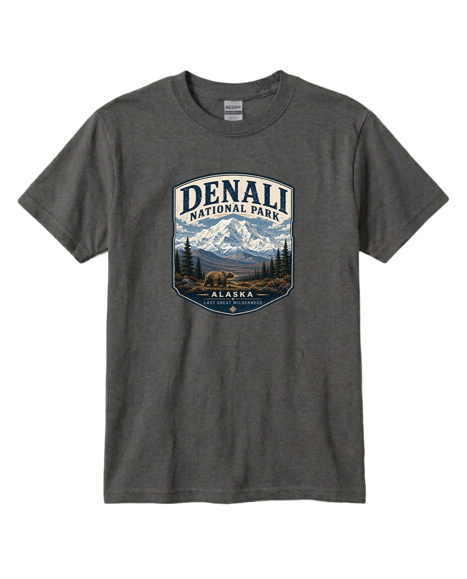 A gray t-shirt with a graphic design depicting a mountain landscape with a bear, surrounded by text that says "DENALI NATIONAL PARK ALASKA LAST GREAT WILDERNESS".