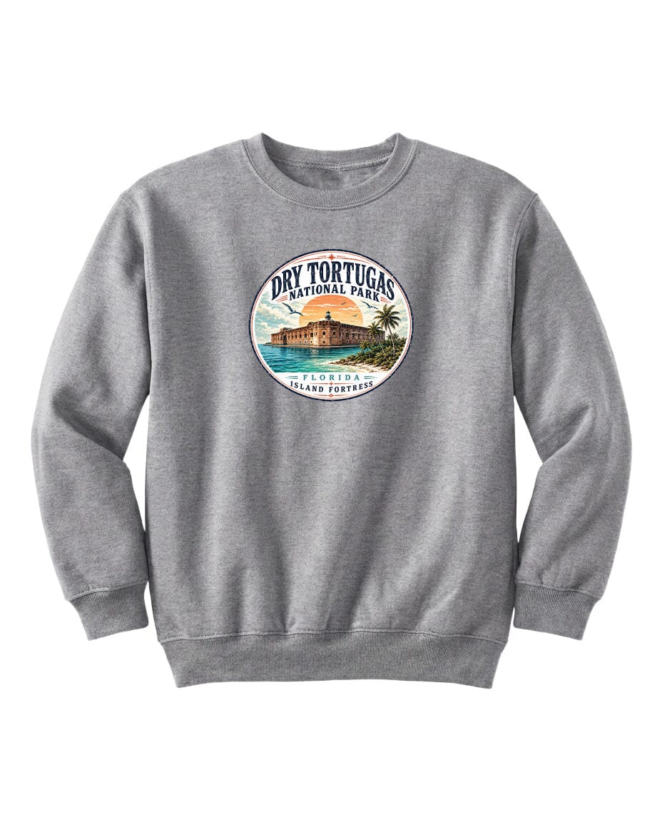 A gray sweatshirt with a circular logo featuring a beach scene and a building, representing Dry Tortugas National Park in Florida.