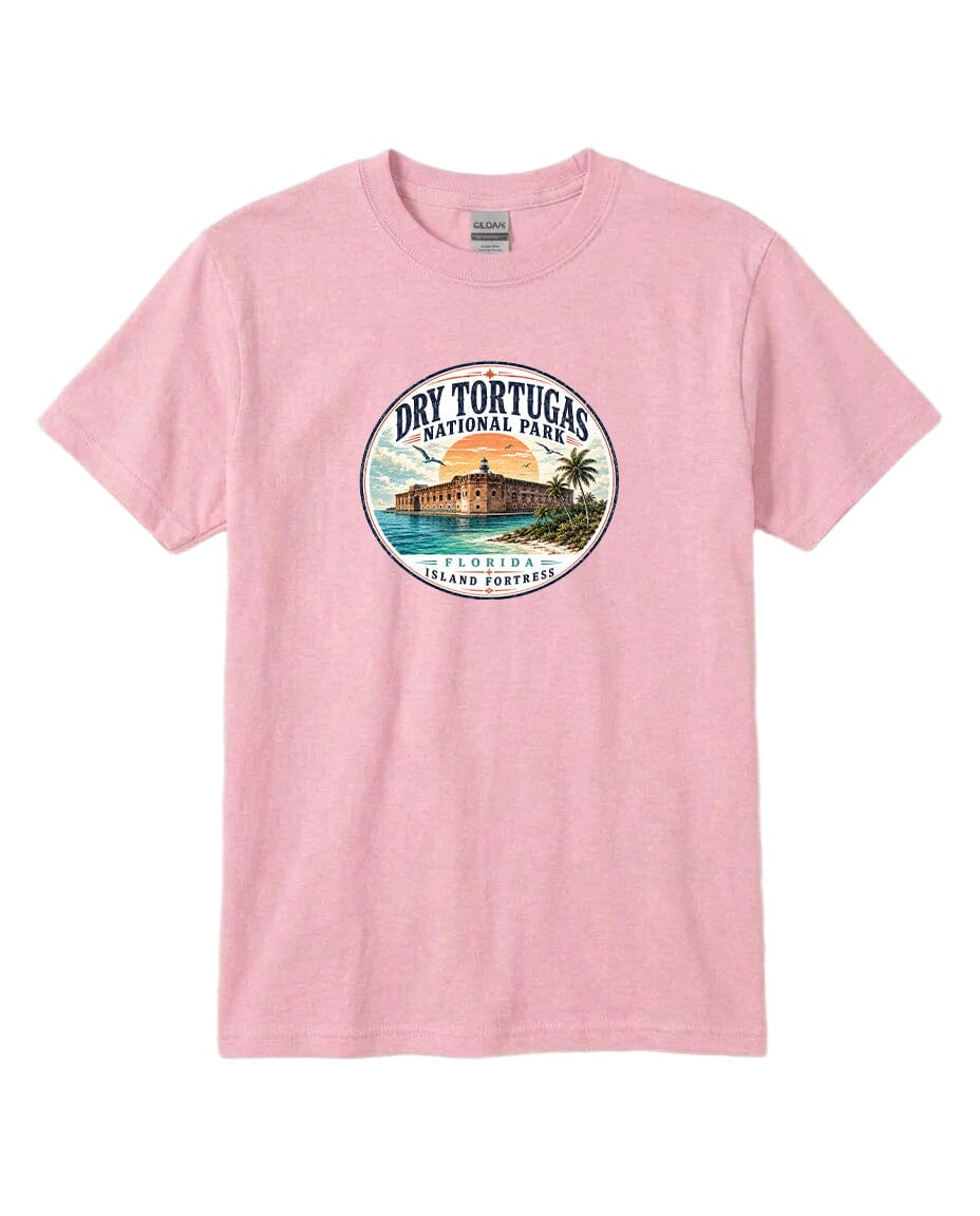 A pink t-shirt with a circular graphic design featuring a beach scene and a building, representing Dry Tortugas National Park in Florida.