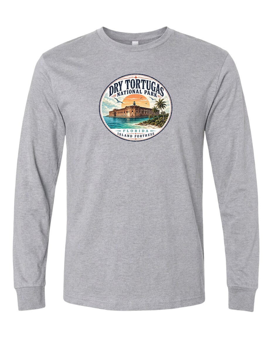 A gray long-sleeved t-shirt with a circular graphic design featuring a tropical island landscape with palm trees, a building, and a body of water.