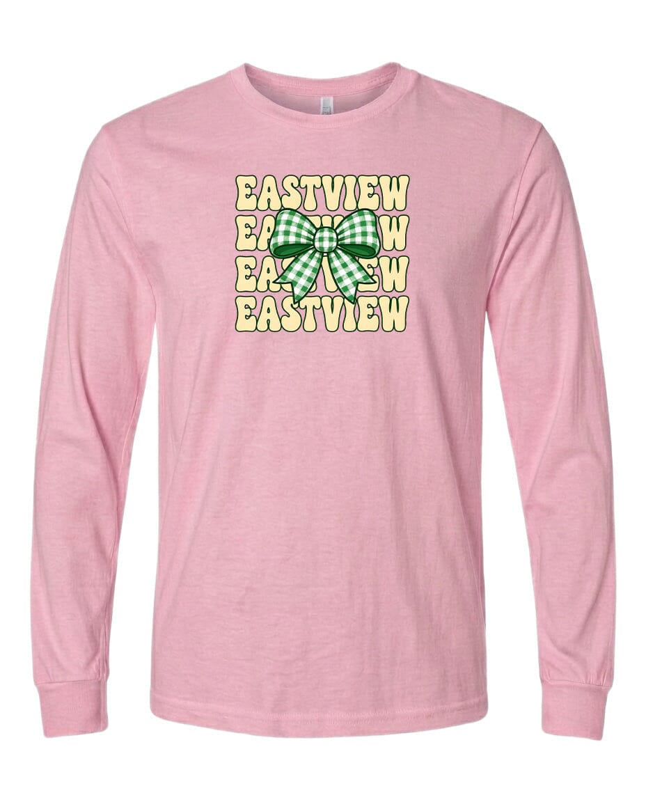A pink long-sleeved t-shirt with a graphic design featuring a green and white bow and the text "EASTVIEW" repeated multiple times in a vertical pattern.