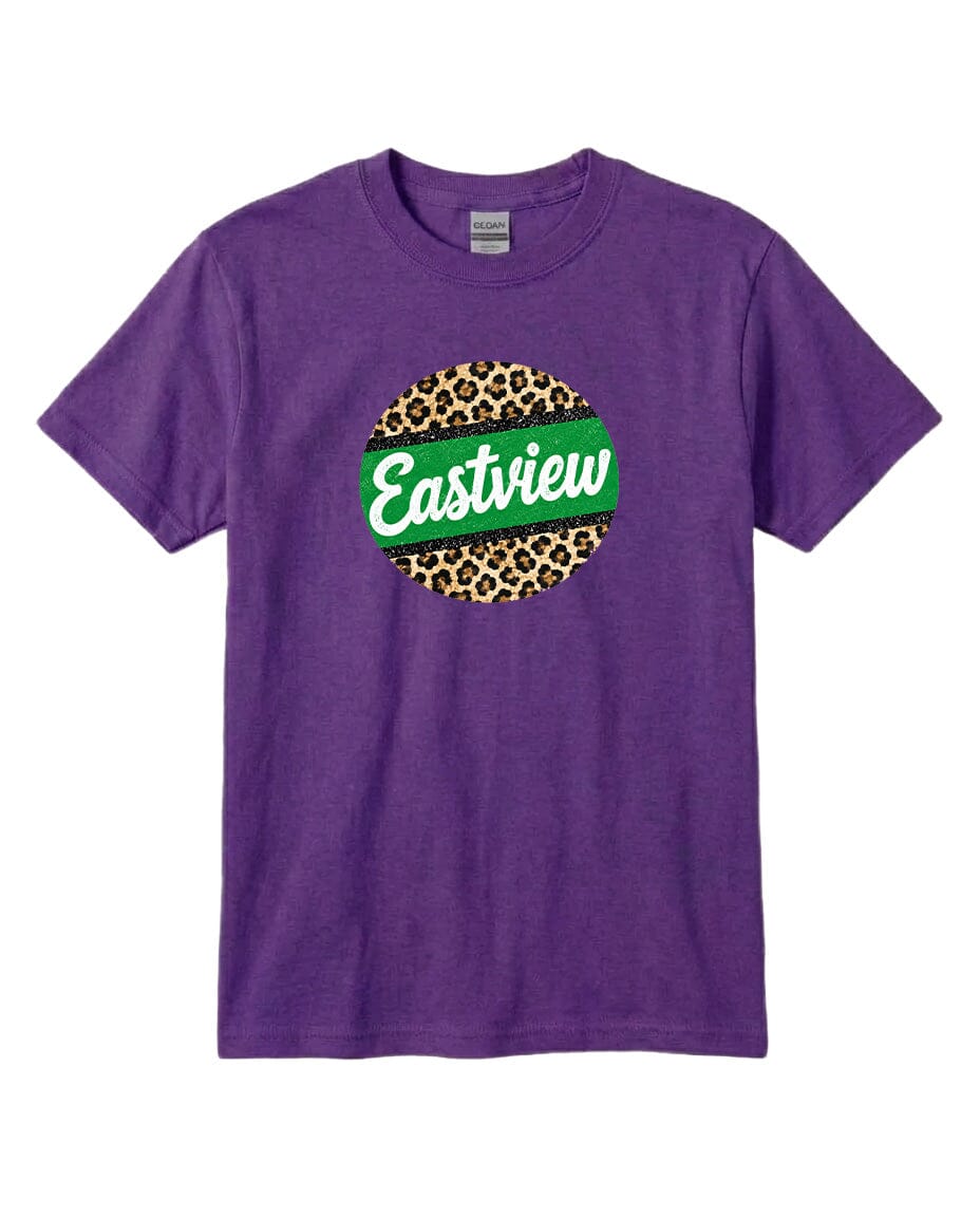 A purple t-shirt with a circular graphic design on it. The design consists of a green circle with a leopard print pattern inside it, and the word "Eastview" written in white cursive letters.