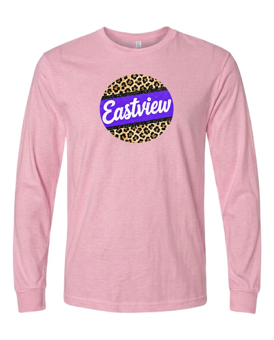 A pink long-sleeved t-shirt with a graphic design on the front. The design consists of a circular shape with a leopard print pattern, and the word "Eastview" written in a stylized font inside the circle.