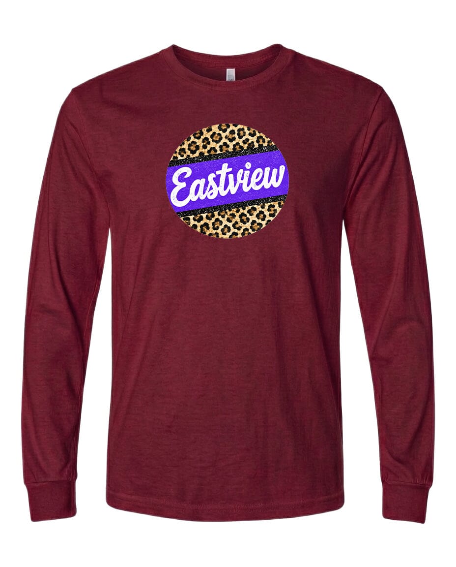 A burgundy long-sleeved t-shirt with a circular graphic design on the front. The design features a leopard print pattern surrounding a purple and white color scheme, with the word "Eastview" written in white text.