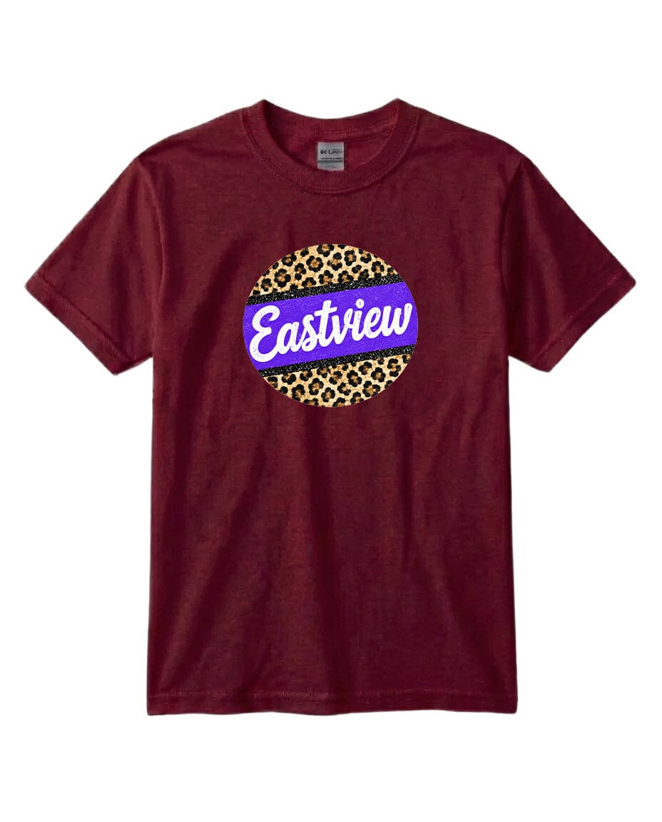 A burgundy-colored t-shirt with a circular graphic design on the front. The design consists of a leopard print circle with a purple border, and the word "Eastview" written in white cursive letters inside the circle.