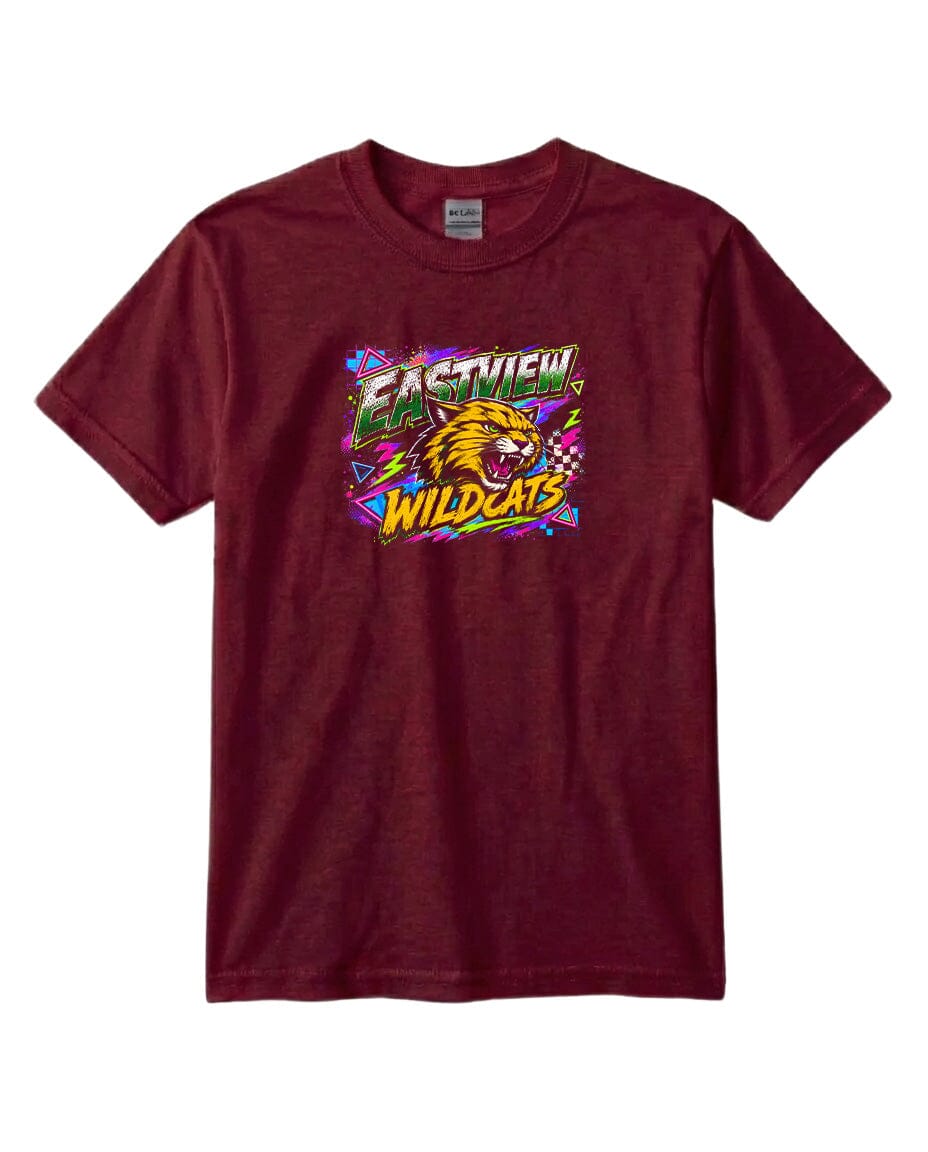 A burgundy-colored t-shirt with a graphic design featuring a stylized depiction of a wildcat's head surrounded by colorful, abstract shapes and text.