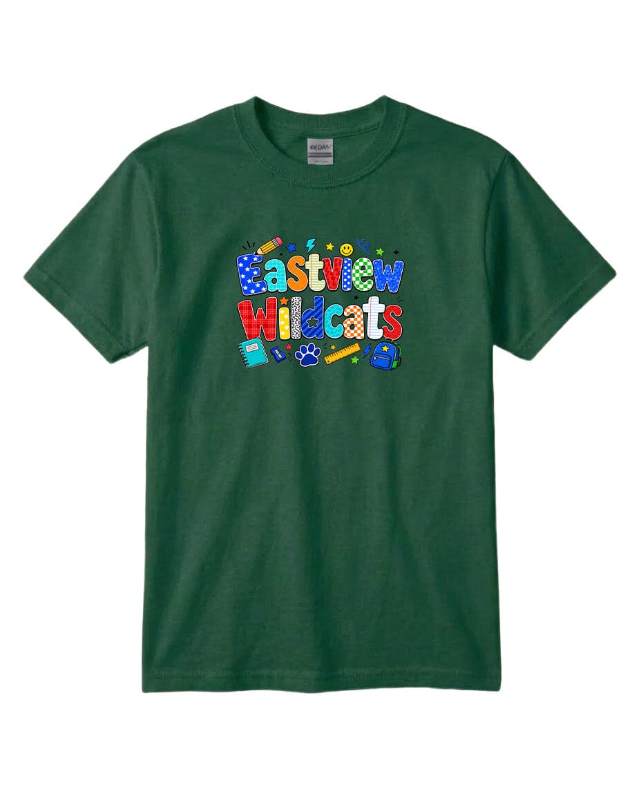 A green t-shirt with a colorful graphic design featuring the text "Eastview Wildcats" and various school supplies such as pencils, backpacks, and a globe.