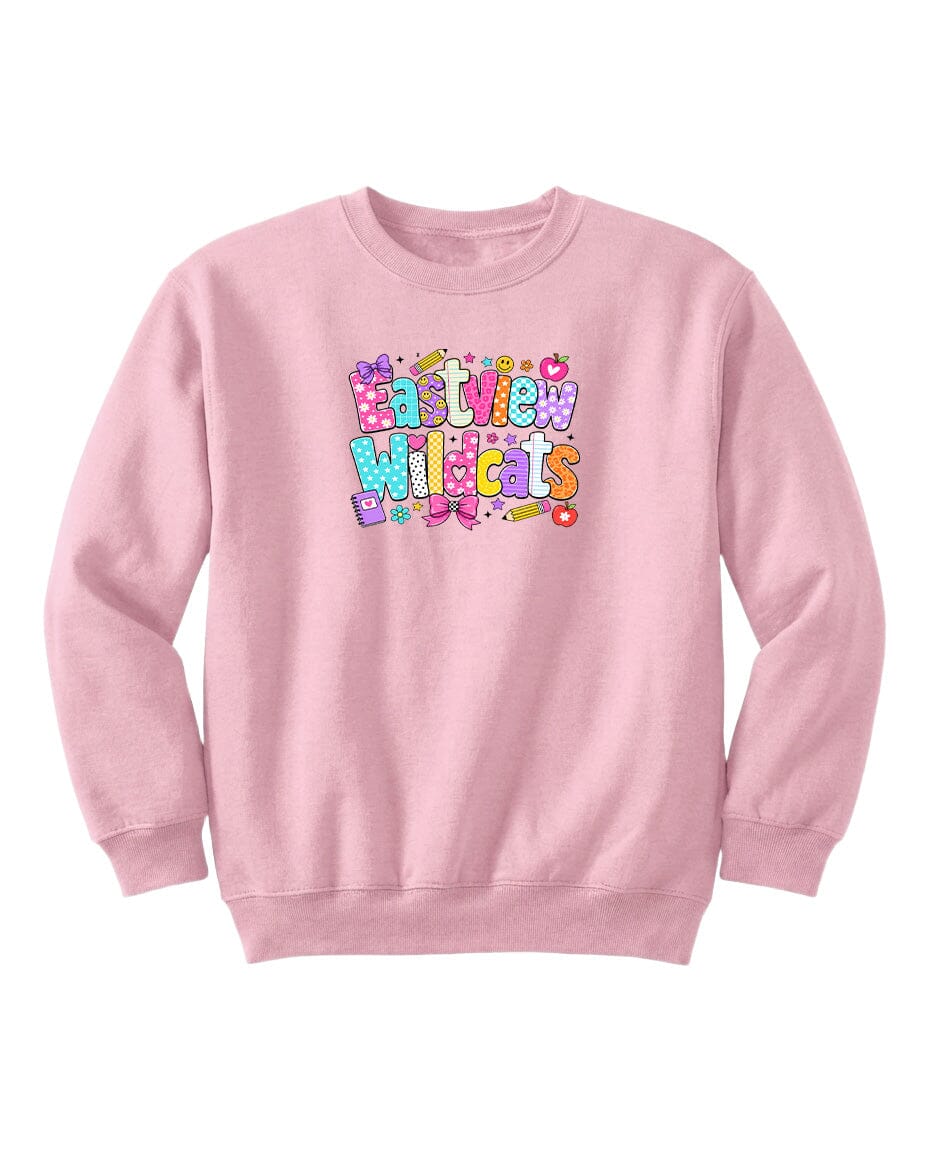 A pink sweatshirt with a colorful graphic design featuring the text "EAST WILDCATS" in a playful, cartoon-like font.
