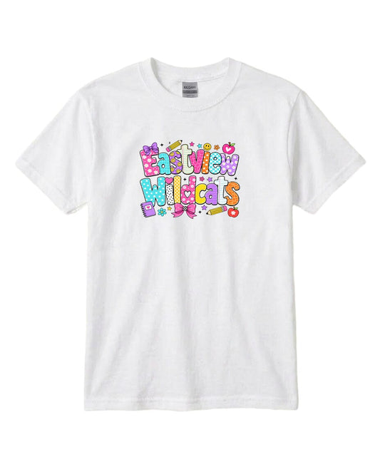 A white t-shirt with a colorful graphic design featuring the text "EAST WILDCATS" in a playful, cartoon-like font.