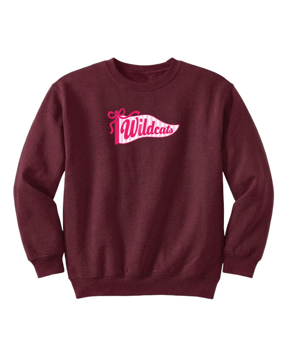 A burgundy sweatshirt with a pink and white logo that says "Wildcats".