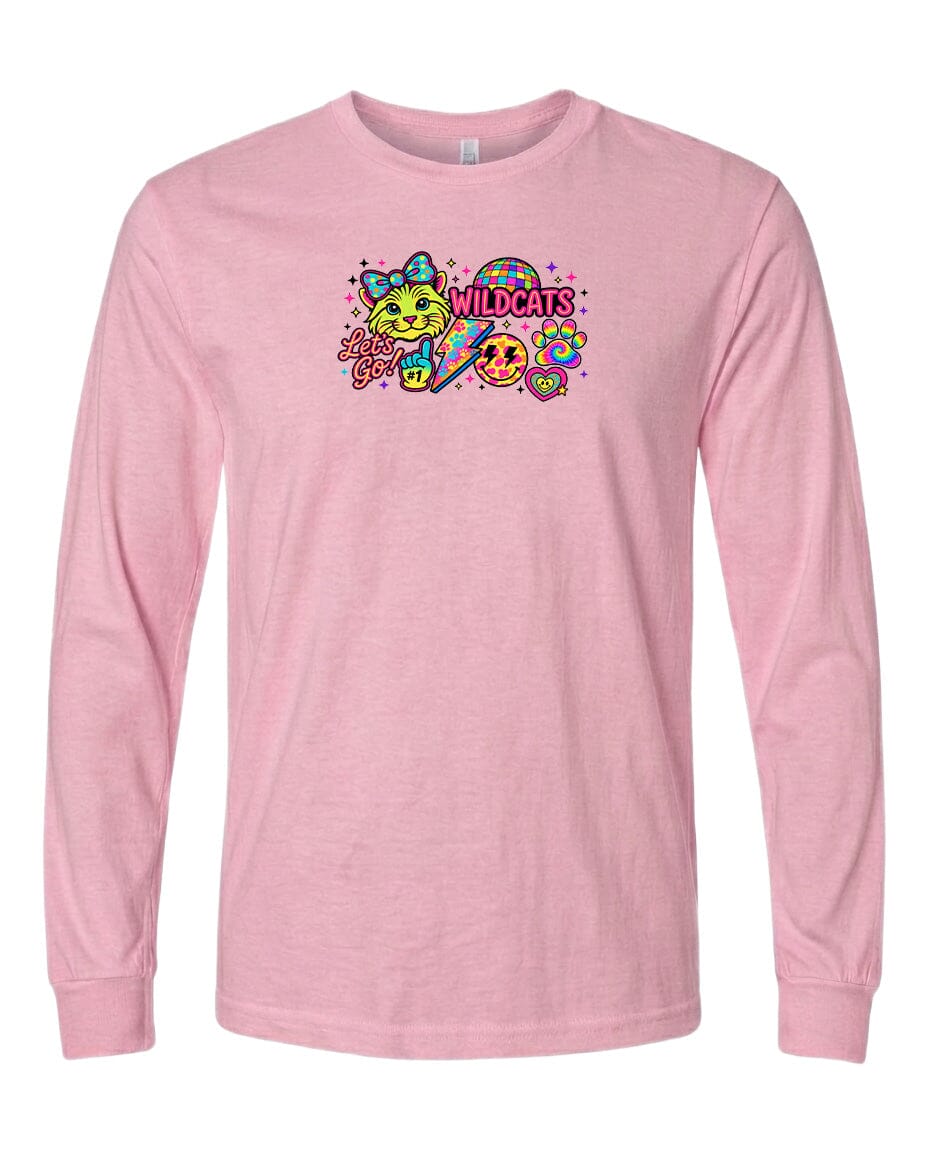 A pink long-sleeved t-shirt with a colorful graphic design featuring a smiling cat, a rainbow, and the text "Wildcats" in a playful font.