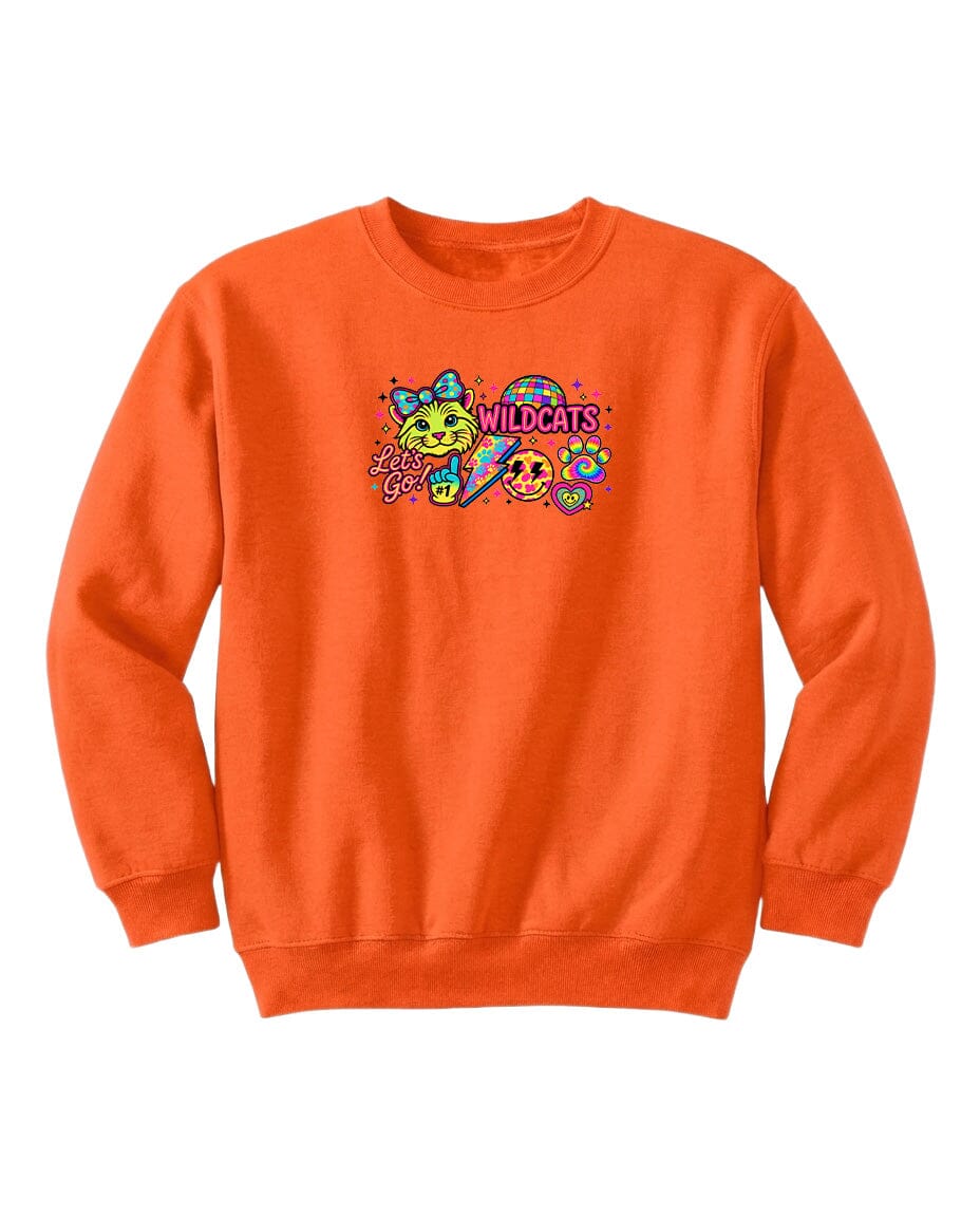 An orange sweatshirt with a colorful graphic design featuring a smiling face, a bow, and the text "WILDCATS" printed on it.