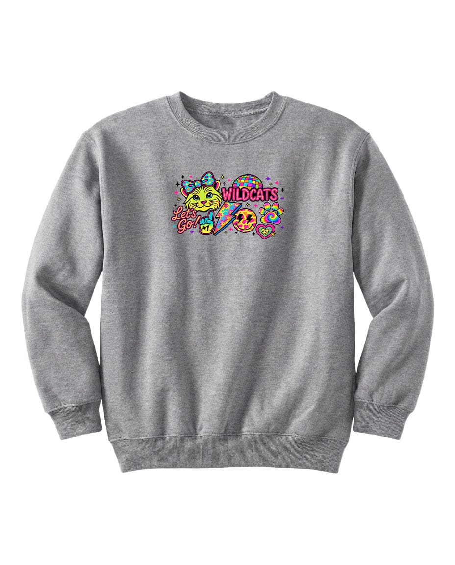 A gray sweatshirt with a colorful graphic design featuring a smiling face, a cat, and the text "WILDCATS" in a playful font.