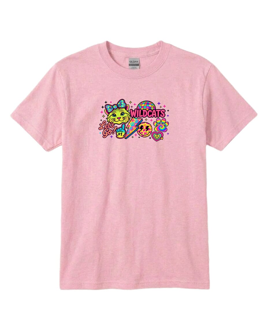 A pink t-shirt with a colorful graphic design featuring a cat, a smiley face, and the text "WILDCATS" along with a heart symbol.